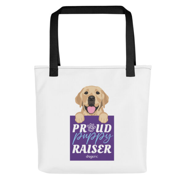 A white tote bag with a dog graphic and 'Proud Puppy Raiser' text in a purple box.