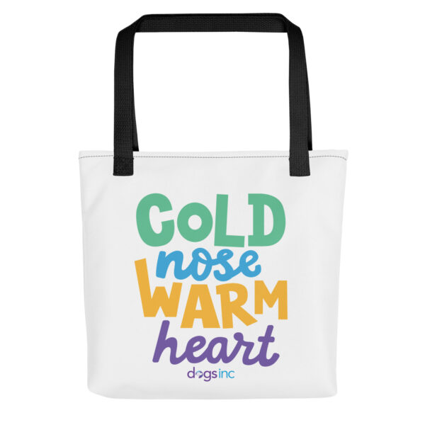 A white tote bag with 'Cold Nose Warm Heart' graphic text in green, blue, yellow, and purple.