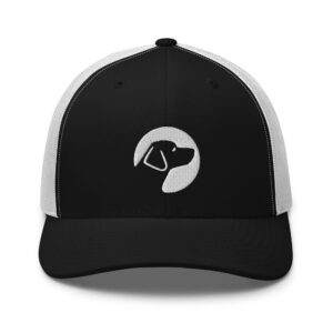 A black and white trucker hat with the Dogs Inc circle logo stitched in white.