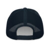 The back of a navy mesh trucker hat.