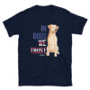 A navy unisex t-shirt with a dog graphic and 'In Dogs We Trust' text in red, white, and blue.