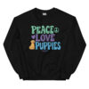 A black crewneck with a dog graphic and 'Peace Love Puppies' text in green, purple, and blue.