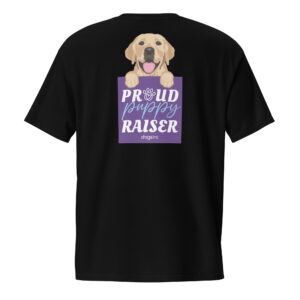 A unisex black t-shirt with a dog graphic and 'Proud Puppy Raiser' text in a purple box on the back.