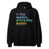 A black sweatshirt with 'A Dog Makes Every Day Better' graphic text in purple, blue, green, and yellow.