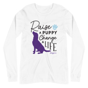 A white long sleeve t-shirt with a dog graphic in purple and 'Raise a Puppy Change a Life' text in black.