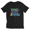 A black v-neck t-shirt with a dog graphic and 'Peace Love Puppies' text in green, purple, and blue.