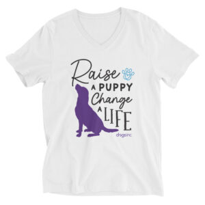 A white v-neck t-shirt with a dog graphic in purple and 'Raise a Puppy Change a Life' text in black.