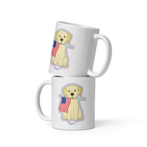 A white coffee mug with a graphic of a dog that holds an American flag in its mouth.