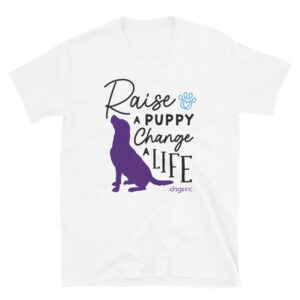 A white unisex t-shirt with a dog graphic in purple and 'Raise a Puppy Change a Life' text in black.