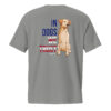 The back of a gray unisex t-shirt with a dog graphic and 'In Dogs We Trust' text in red, white, and blue.