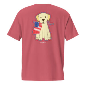 The back of a red unisex t-shirt with a graphic of a dog that holds an American flag in its mouth.