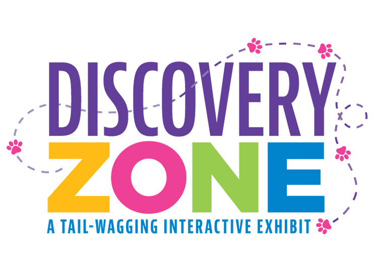 Purple text reads Discovery. Yellow, pink, green, and blue text reads Zone. Blue text reads A Tail-Wagging Interactive Exhibit.